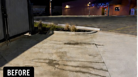 Coffee-stand drive-thru concrete before cleaning: oil-stained