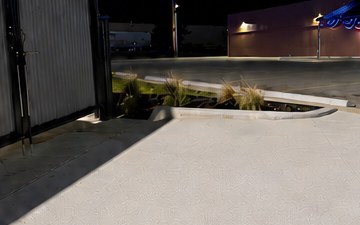 Drive-thru concrete at a coffee stand after hot-water cleaning