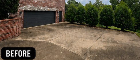 Driveway before cleaning: gray, stained concrete